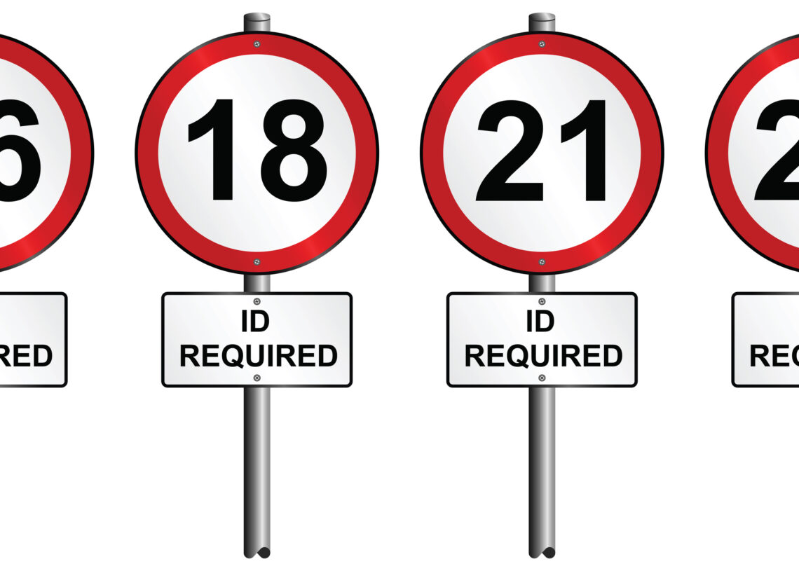 Set of age restriction signs mounted on post