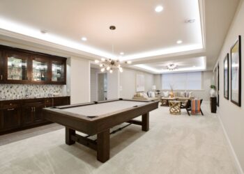 Billiards table with kitchenette nearby for everything you need in the basement