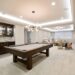 Billiards table with kitchenette nearby for everything you need in the basement